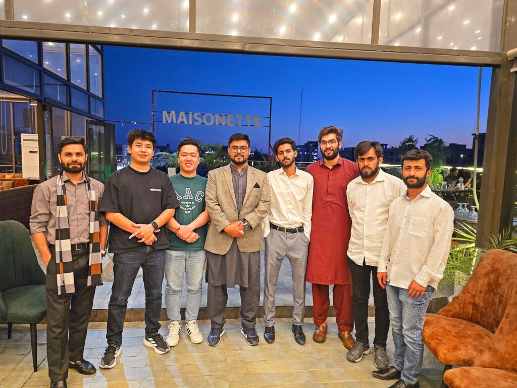 Compilex IT employees sharing conversations and bonding over dinner – showcasing employee engagement and workplace connection.